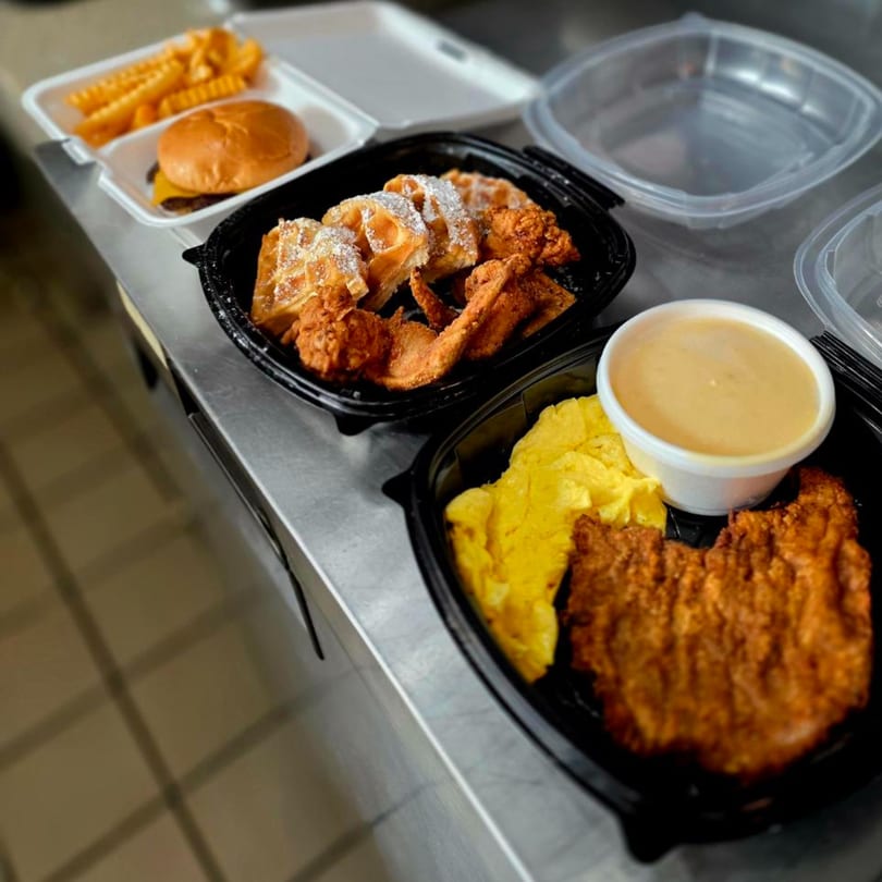 Southern Stop's fried chicken and waffles, burger and fries, and chicken fried steak with gravy.